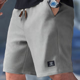 NATHAN | Kerged suvepüksid